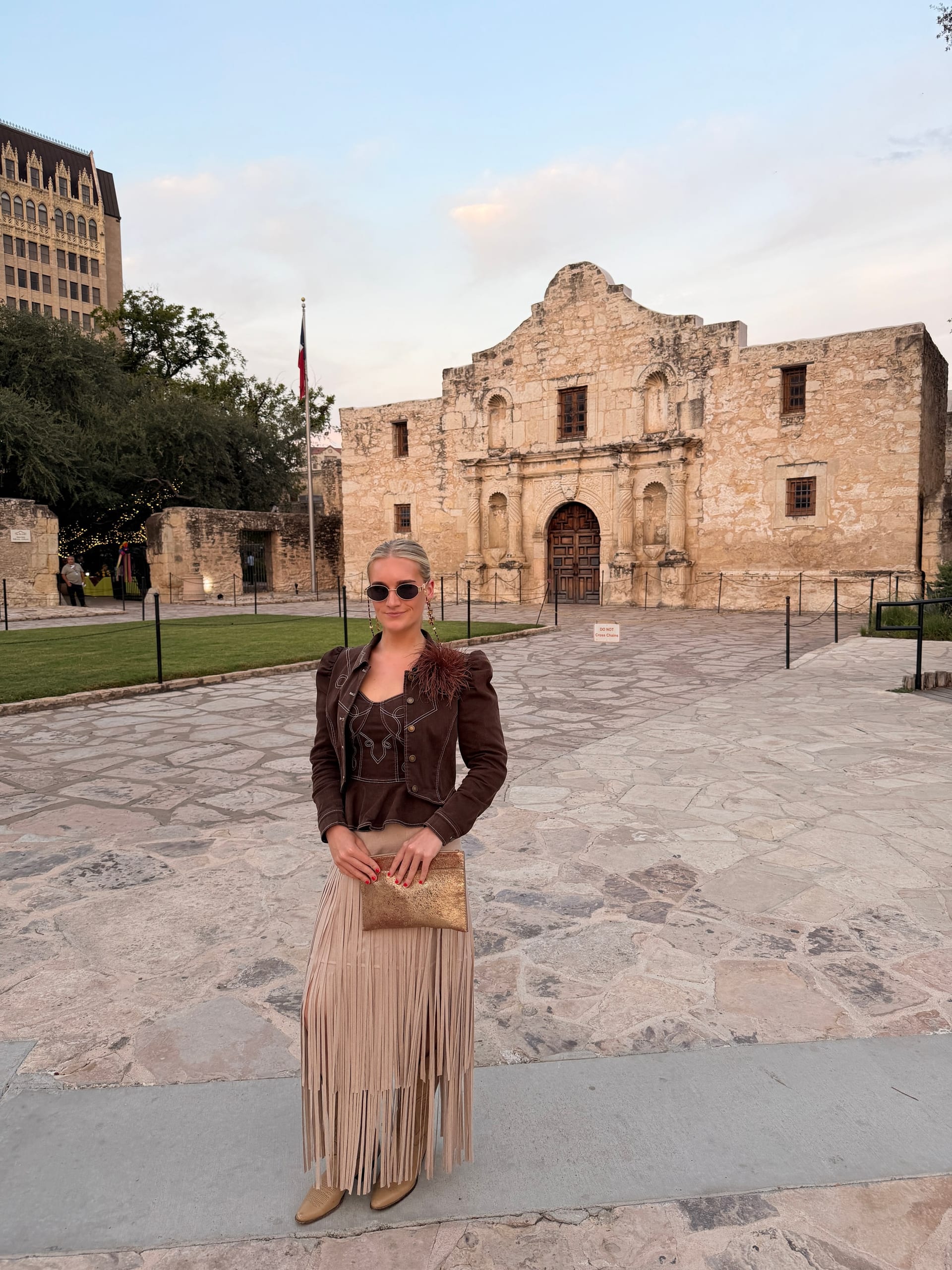 Carson outside the Alamo in San Antonio, Texas, at dusk.